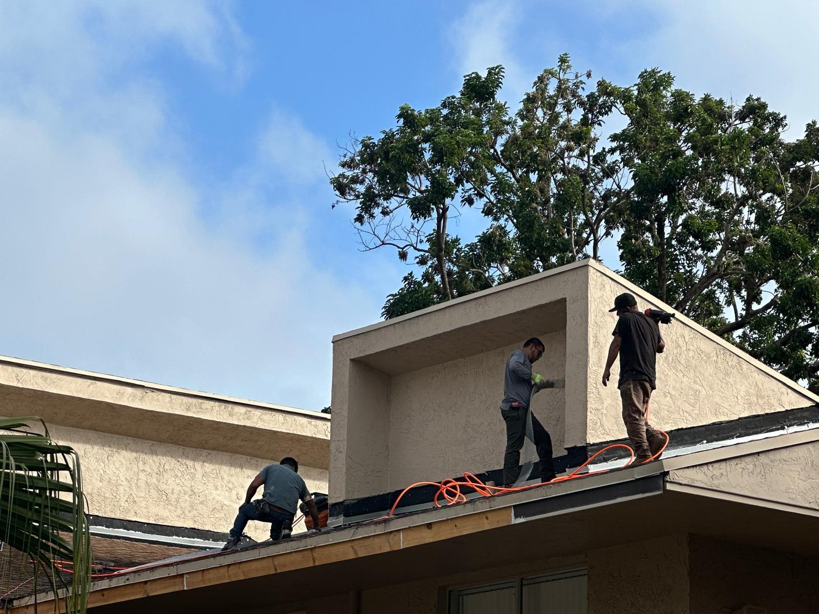 Two-story commercial building with scaffolding during exterior painting